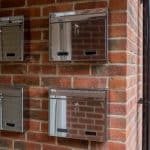 W2N Wall Mounted Stainless Steel External Post Box installed on a brick wall