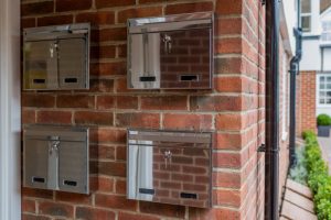 W2N Wall Mounted Stainless Steel External Post Box installed on a brick wall