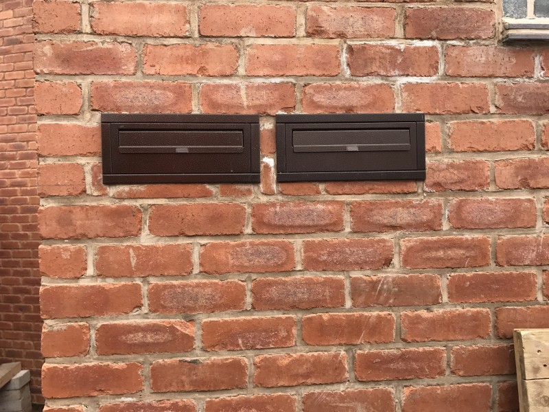 SM Copper Through The Wall External Post Box installed in a brick wall