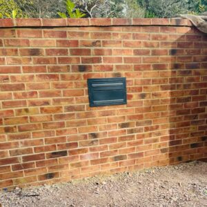 Through The Wall Parcel Box Sierra Black Lifestyle Photo 1 Through The Wall Parcel Box Sierra Black Lifestyle Photo 1