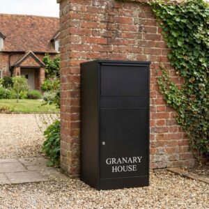 Free Standing Front Access Buzzard Outdoor Extra Large Parcel Box Black Lifestyle Photo Free Standing Front Access Buzzard Outdoor Extra Large Parcel Box Black Lifestyle Photo